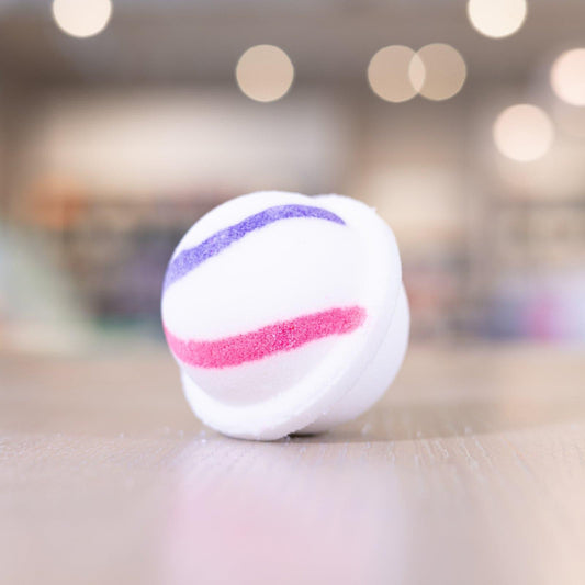 Purple and pink design on white circle bath bomb
